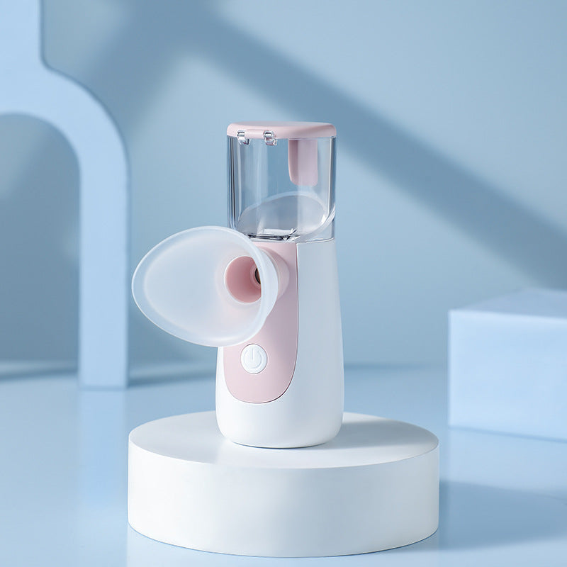 Compact Recore nano-spray handheld device emitting moisturizing water mist